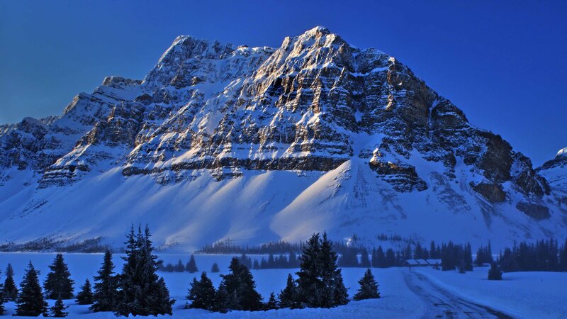 Snow-covered Mountain Peak — Blue, Serene, Winter, Photograph, Trees, Lake