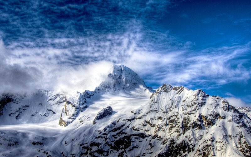 Snow-covered Mountain Peak — Clouds