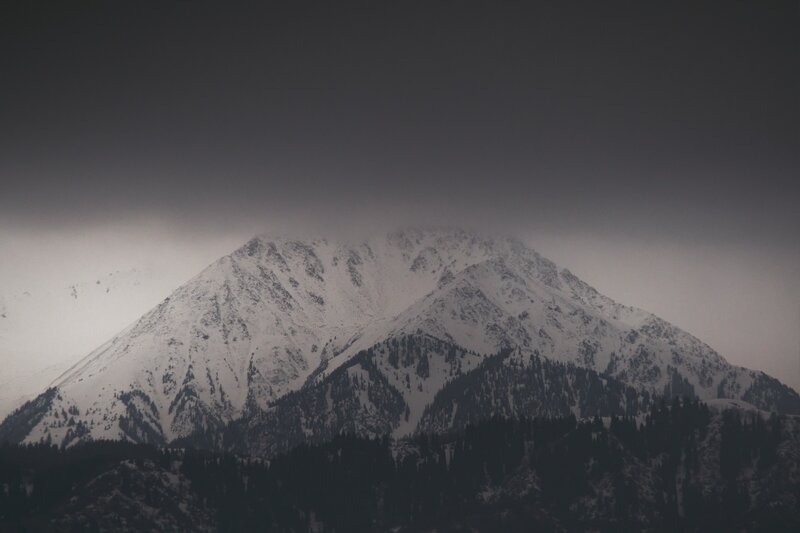 Snow-covered Mountain Peak — Gray, Dramatic, Winter, Photograph, Clouds