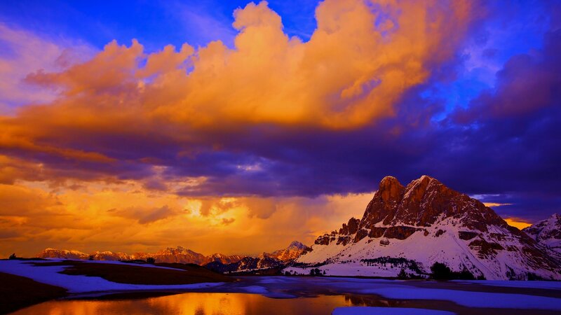 Snow-covered Mountain Peak — Orange, Dramatic, Sunset, Photograph