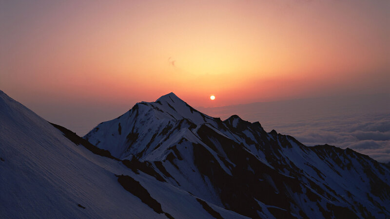 Snow-covered Mountain Peak — Orange, Serene, Sunset