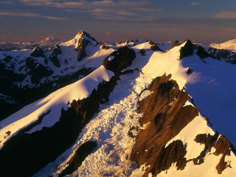 snow-covered mountain peaks at sunrise