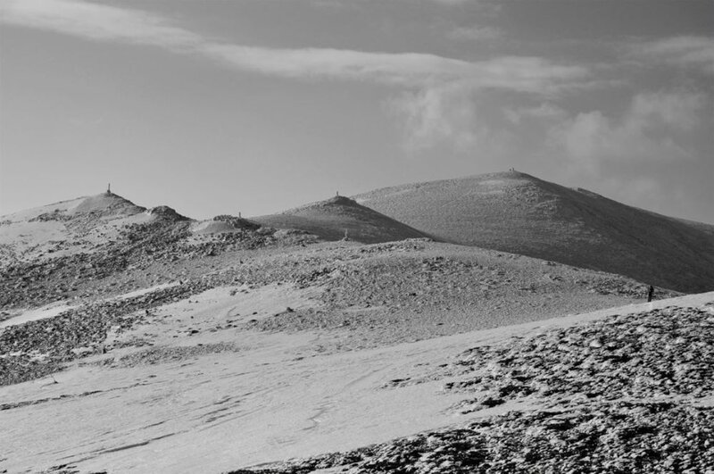 Snow-covered Mountain Peaks — Black, Desolate