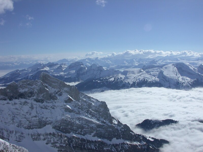Snow-covered Mountain Peaks — Blue, Serene, Afternoon, Photograph, Clouds, Sky, Mountains