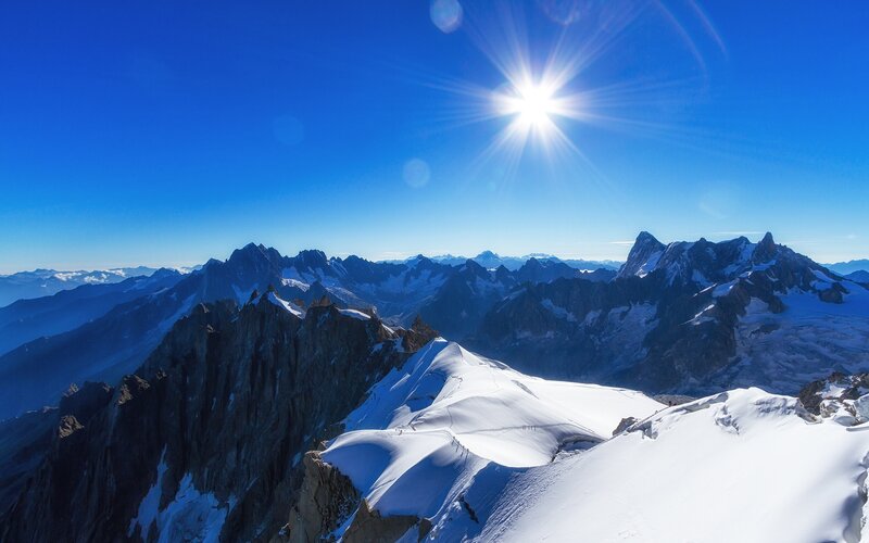 Snow-covered Mountain Peaks — Blue, Serene, Afternoon, Photograph, Sun, Sky, Mountains