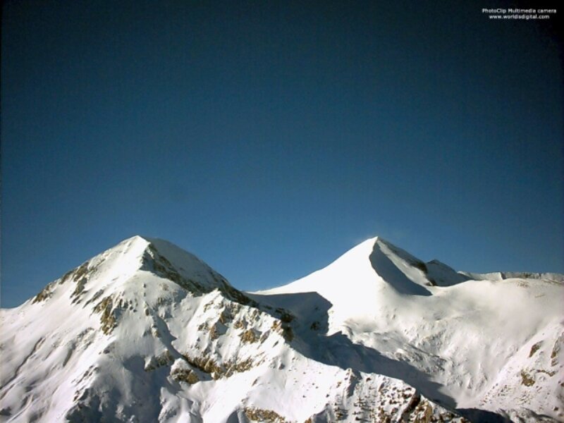 Snow-covered Mountain Peaks — Blue