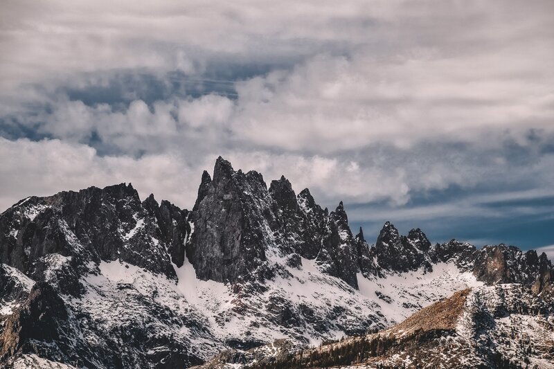Snow-covered Mountain Peaks — Gray, Dramatic, Winter, Photograph, Mountains