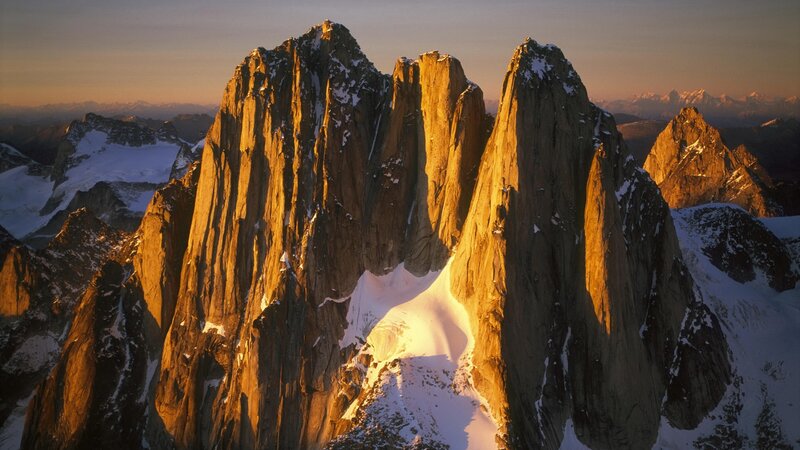 Snow-covered Mountain Peaks — Orange, Dramatic