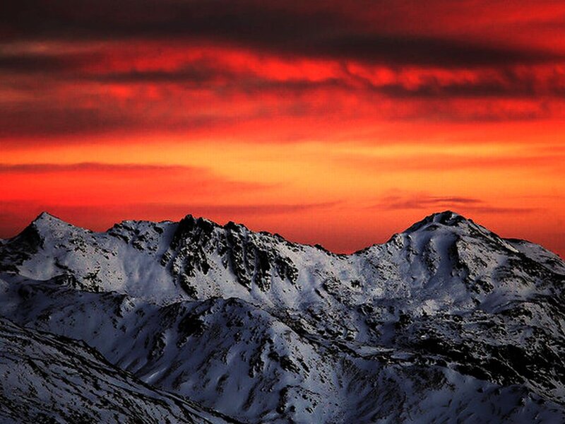 Snow-covered Mountain Peaks — Red, Dramatic