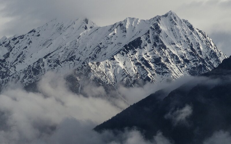 Snow-covered Mountain Peaks — White, Dramatic, Photograph, Clouds, Mountains, Forest