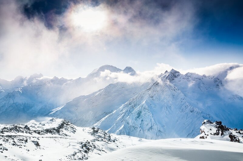 Snow-covered Mountain Peaks — White, Dramatic, Winter, Photograph, Clouds, Sunlight
