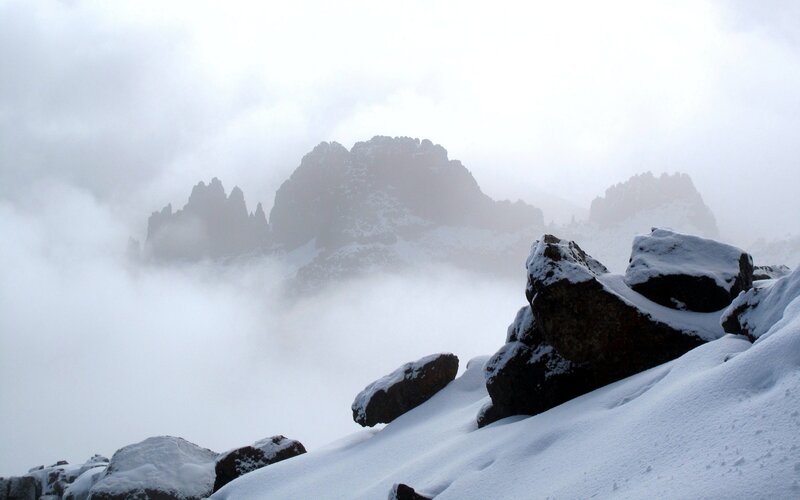 Snow-covered Mountain Peaks — White, Misty
