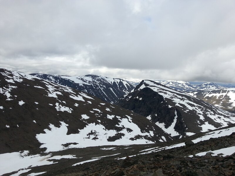 Snow-covered Mountain Peaks — White, Overcast