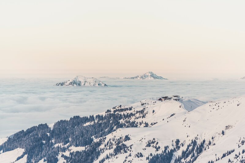 Snow-covered Mountain Peaks — White, Serene, Winter, Photograph, Clouds, Trees, Ski Resort
