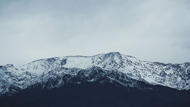 Snow-covered Mountain Range — Gray, Dramatic, Winter, Photograph, Snow