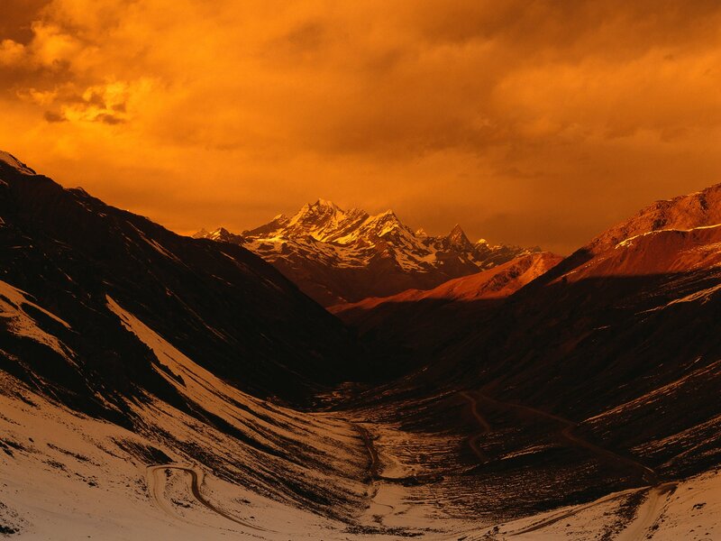 Snow-covered Mountain Range — Orange, Dramatic, Sunset, Photograph, Mountains, Valley