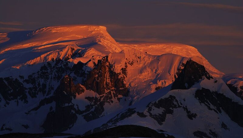 Snow-covered Mountain Range — Orange, Dramatic