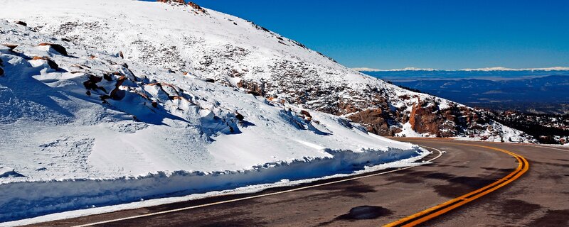 Snow-covered Mountain Road — White, Serene, Winter