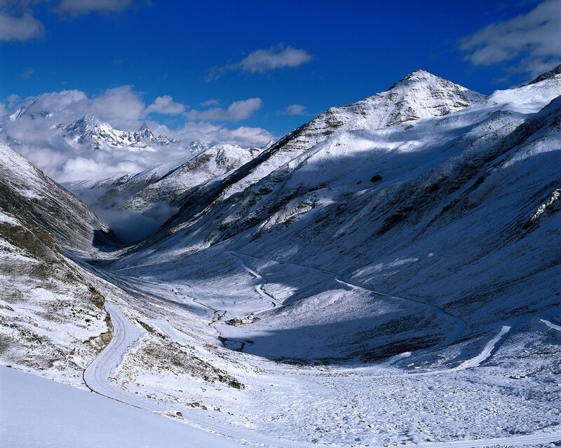 Snow-covered Mountain Valley — Blue, Serene, Winter, Photograph, Mountains, Road, Clouds