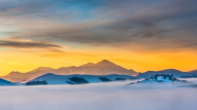 Snow-covered Mountain Village — Orange, Serene, Sunset
