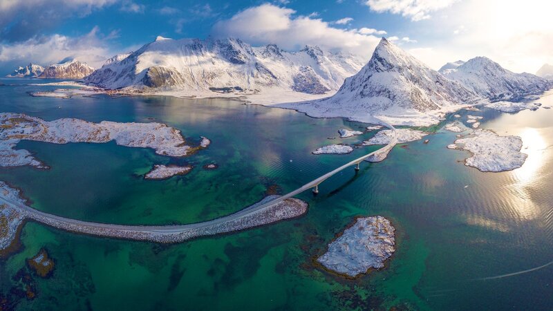 Snow-covered Mountains and Bridge
