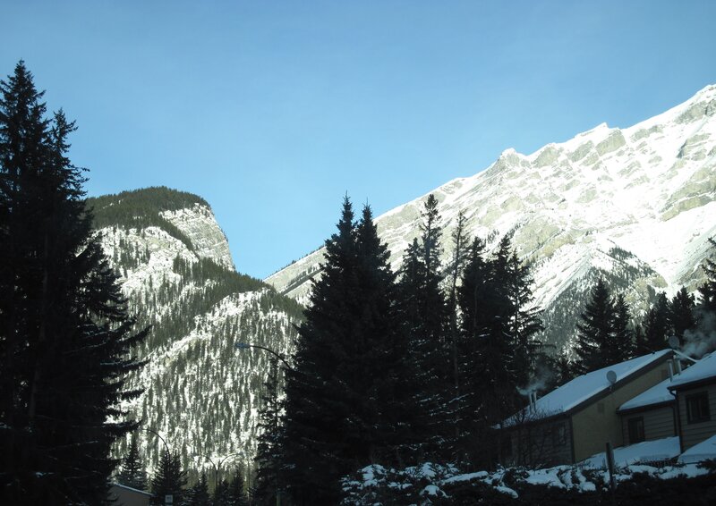 Snow-covered Mountains — Blue, Serene, Winter, Photograph, Trees, Buildings