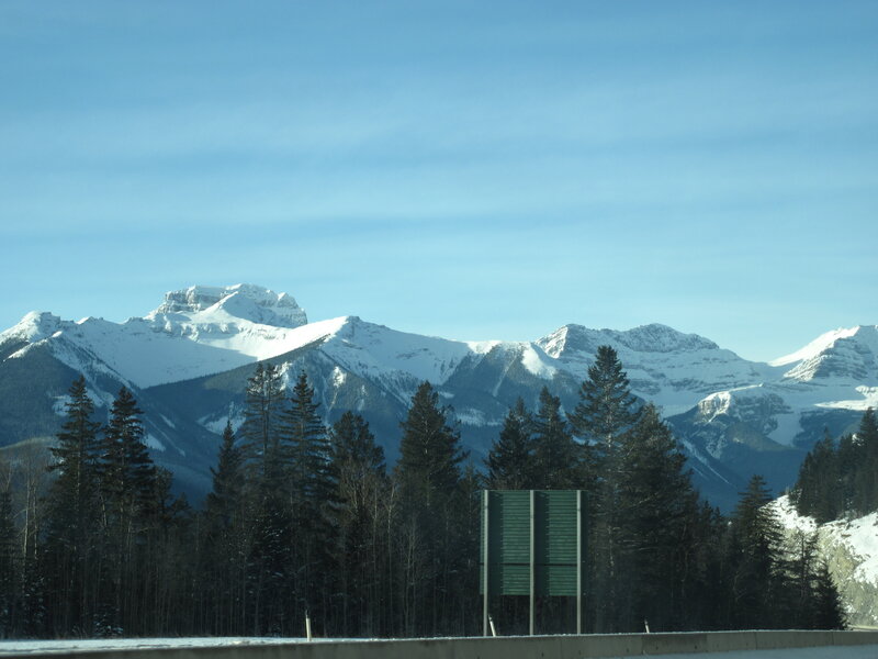 Snow-covered Mountains — Blue, Serene, Winter, Photograph, Trees, Highway Sign
