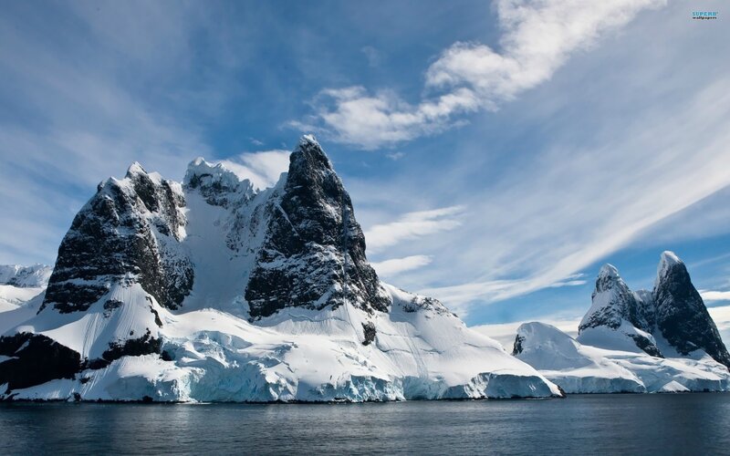 Snow-covered mountains by the sea