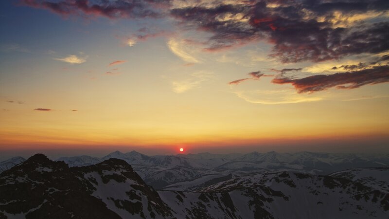 Snow-covered Mountains — Orange, Serene, Sunset, Photograph, Sun, Clouds, Yellow, Purple