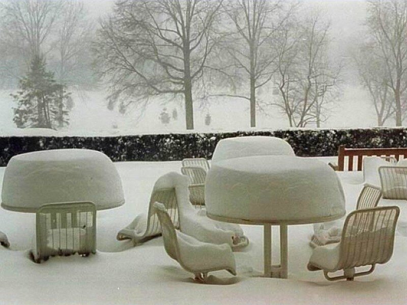 Snow-covered outdoor furniture
