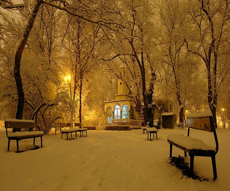 Snow-covered Park Bench — Yellow, Serene, Night