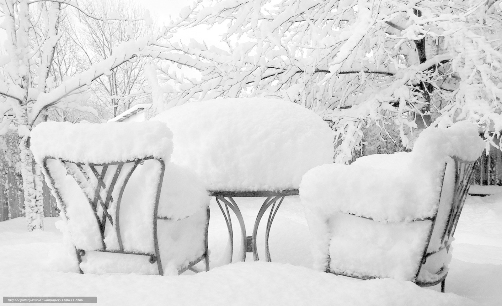 Snow-covered patio furniture
