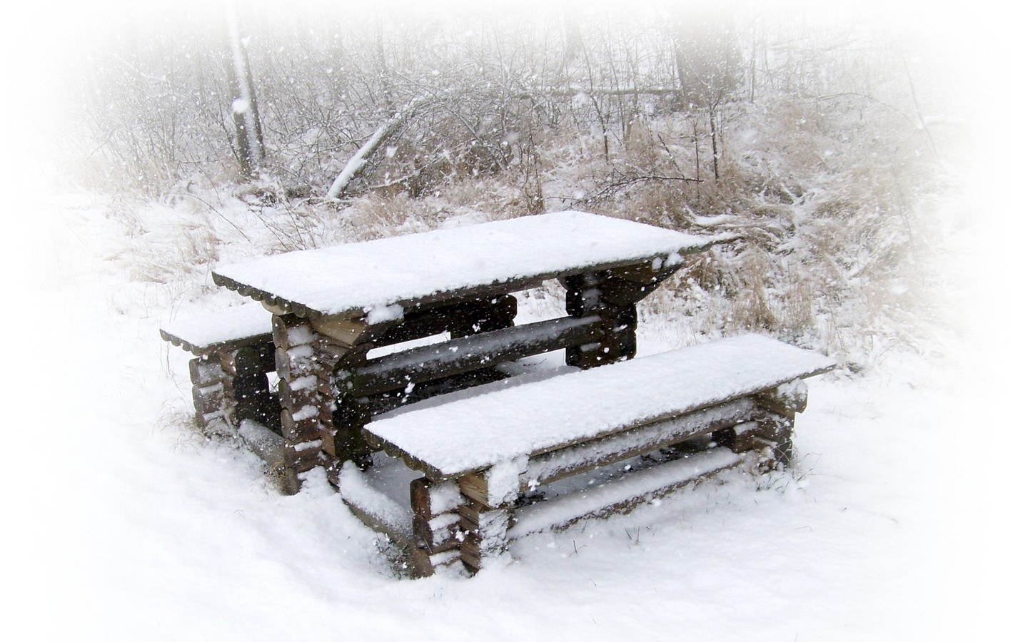 Snow-covered picnic table