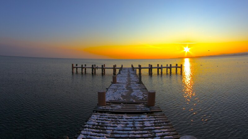 Snow-covered Pier at Sunset