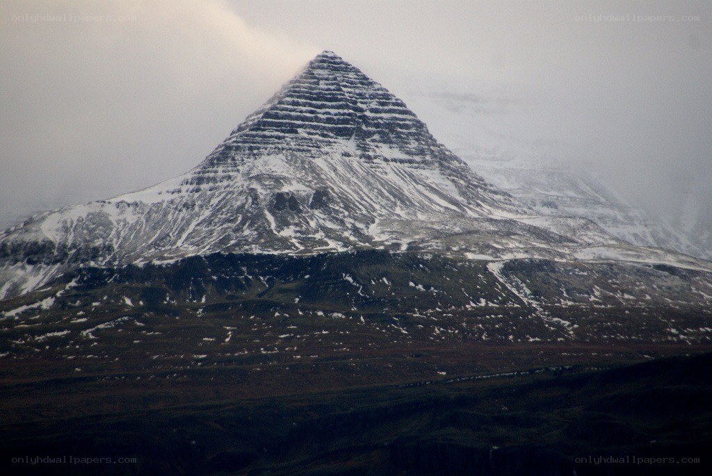 snow-covered pyramid mountain