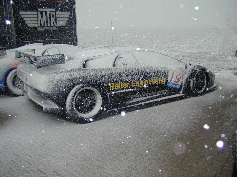 Snow-covered race car at track