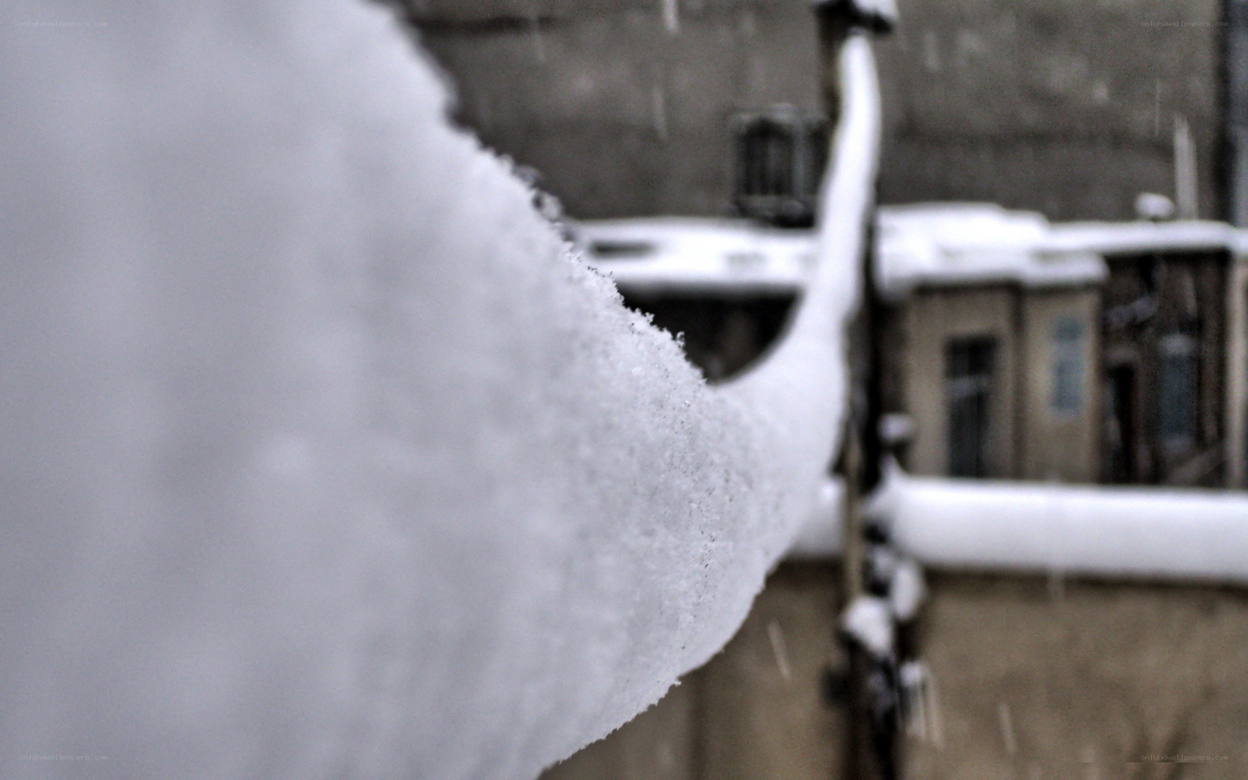 snow-covered railing in winter