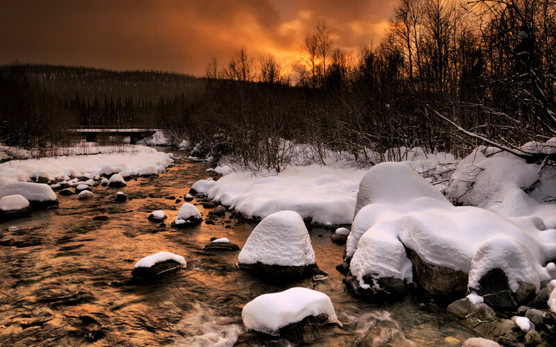 Snow-covered River at Sunset — Orange, Dramatic, Photograph