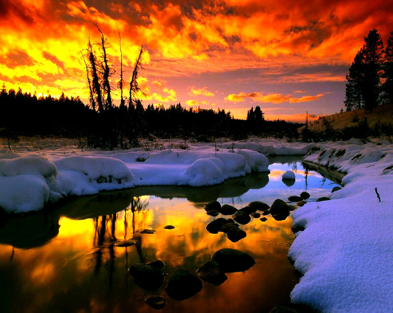 Snow-covered River at Sunset — Orange, Dramatic