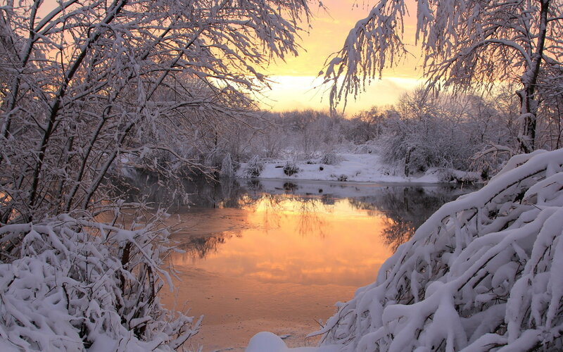 Snow-covered River at Sunset — Orange, Serene