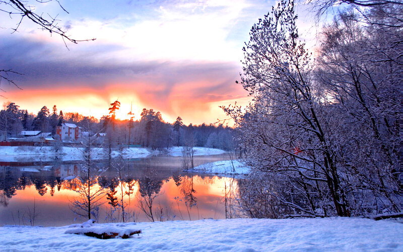 Snow-covered River at Sunset — Orange