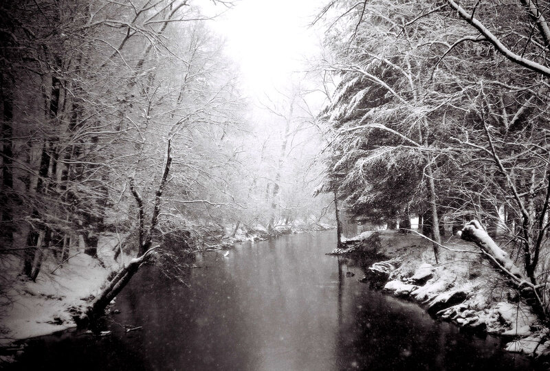 Snow-covered River in Forest — Black, Serene, Winter