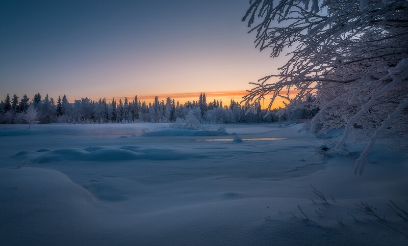 Snow-covered River Landscape — Blue, Serene, Sunset