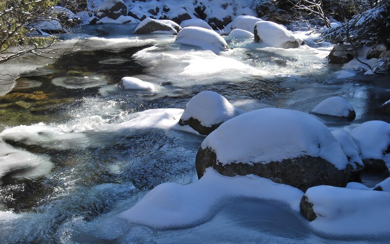 Snow-covered River Rocks — White, Serene