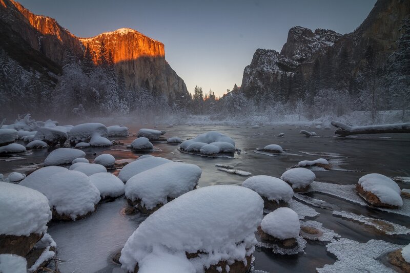 Snow-covered River Rocks — White, Serene, Winter