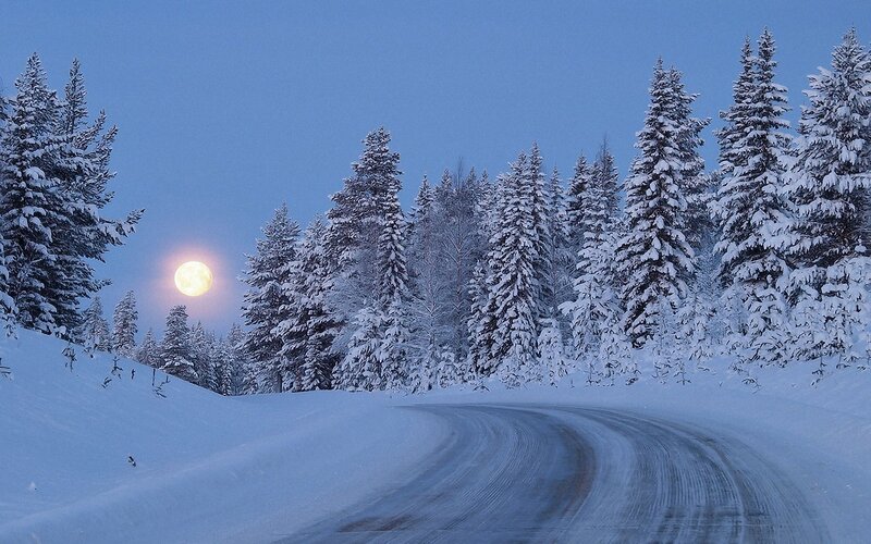 Snow-covered Road at Night — Photograph