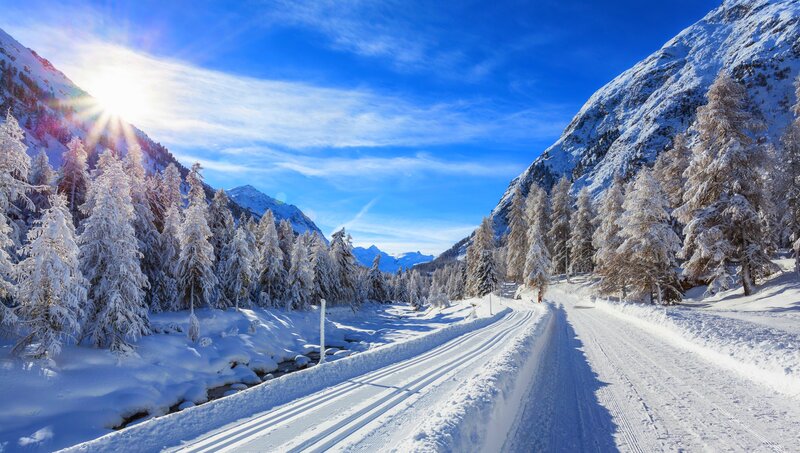 Snow-covered Road in Mountains — Blue