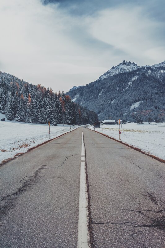 Snow-covered Road in Mountains — Gray, Serene
