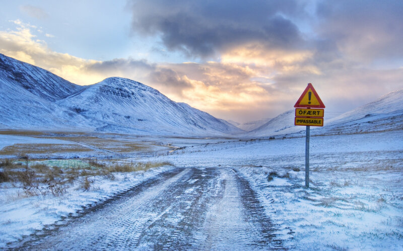 Snow-covered Road Sign