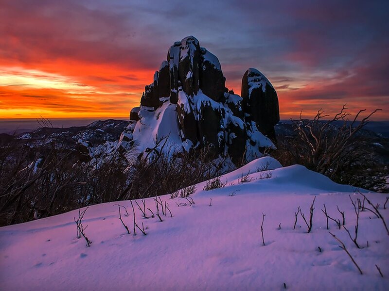 Snow-covered Rock Formation — Red